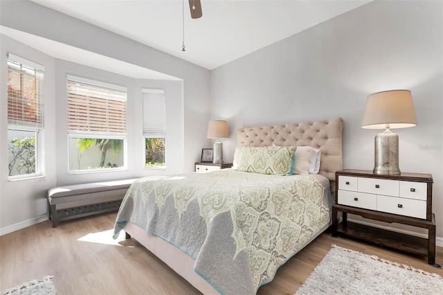 bedroom with ceiling fan and hardwood / wood-style floors