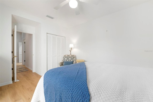 bedroom featuring a closet, ceiling fan, and light hardwood / wood-style floors