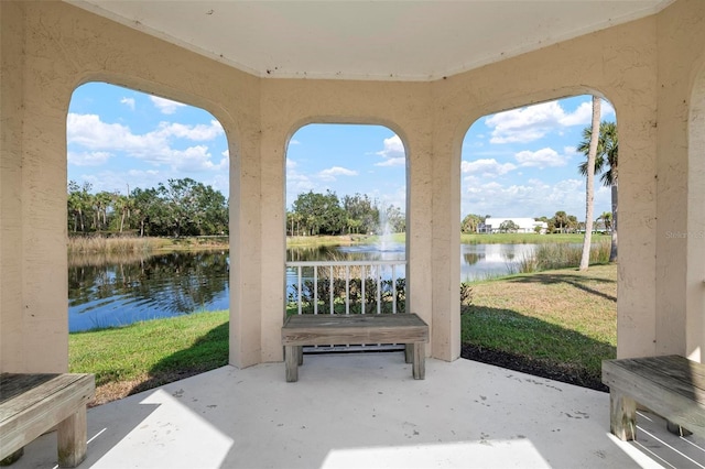 view of patio featuring a water view