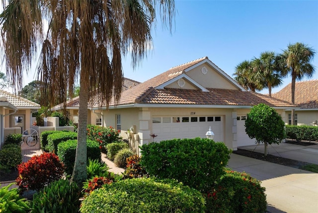 single story home featuring a garage