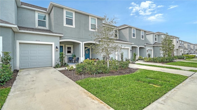 8533 Lunar Skye St, Sarasota, FL 34241 - multi unit property with a garage and a front lawn