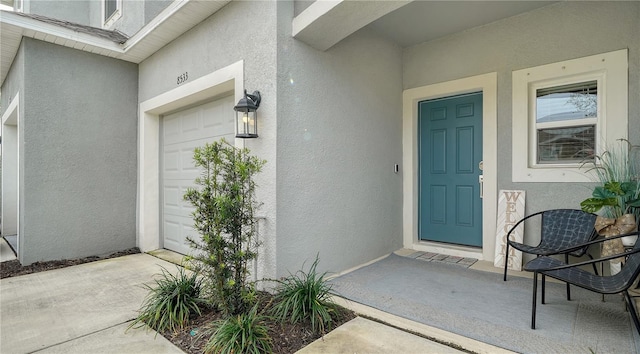 entrance to property featuring a garage