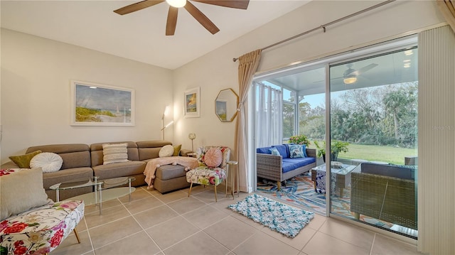 living room with ceiling fan and light tile patterned flooring