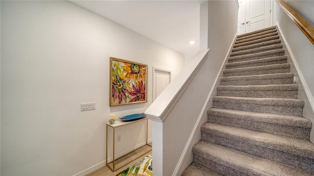 stairs featuring tile patterned floors