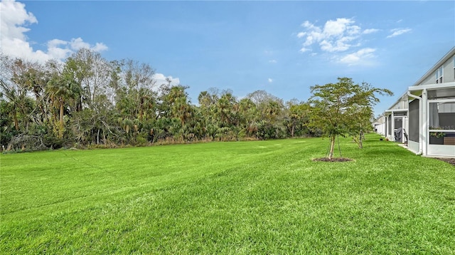 view of yard with a lanai