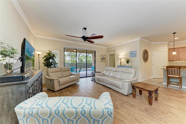 living room featuring crown molding, ceiling fan, and light hardwood / wood-style flooring