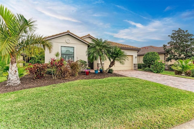 view of front of home featuring a garage and a front lawn