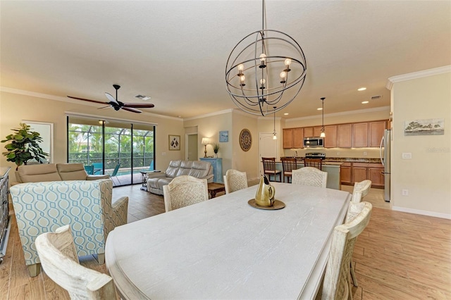 dining room featuring crown molding, ceiling fan with notable chandelier, and light hardwood / wood-style floors