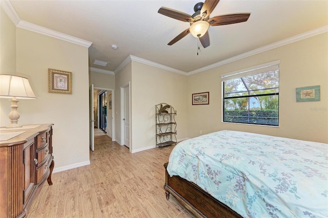 bedroom featuring ornamental molding, ceiling fan, and light hardwood / wood-style floors