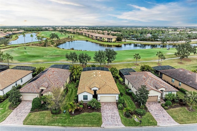 birds eye view of property with a water view