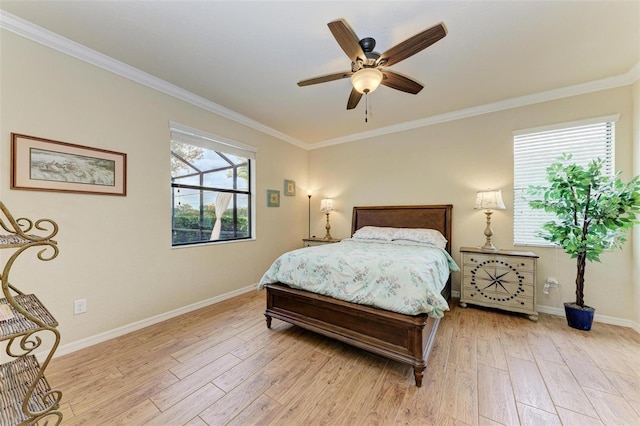 bedroom featuring multiple windows, ceiling fan, and light hardwood / wood-style floors