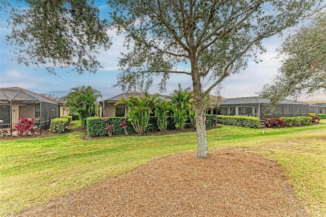 view of yard featuring glass enclosure