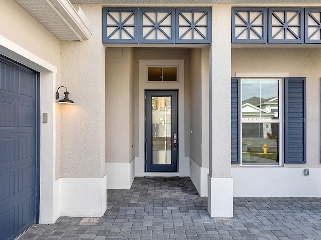 doorway to property featuring a garage