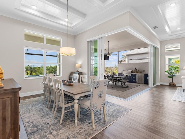 dining room with ceiling fan, wood ceiling, hardwood / wood-style floors, and beamed ceiling