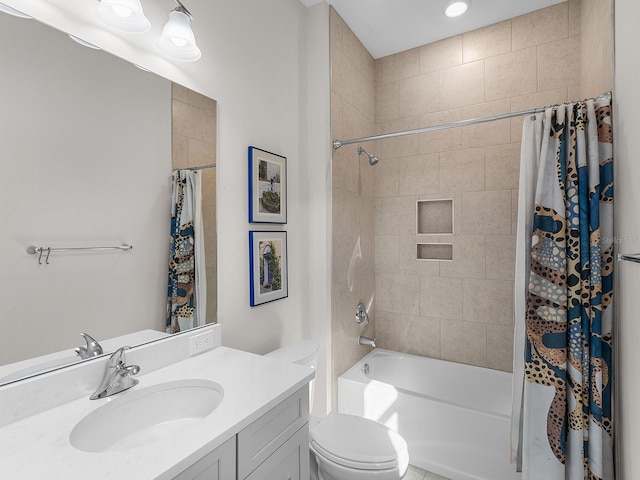 full bathroom featuring toilet, shower / bath combo, and vanity