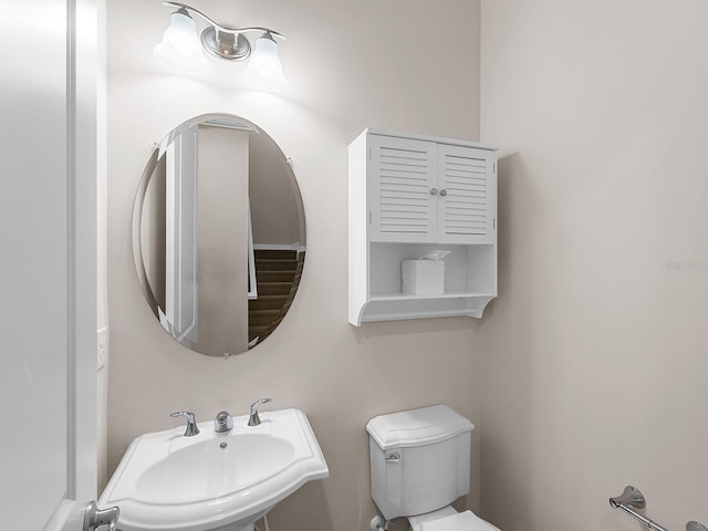 bathroom featuring toilet and sink