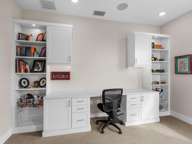 office area with light carpet and built in desk