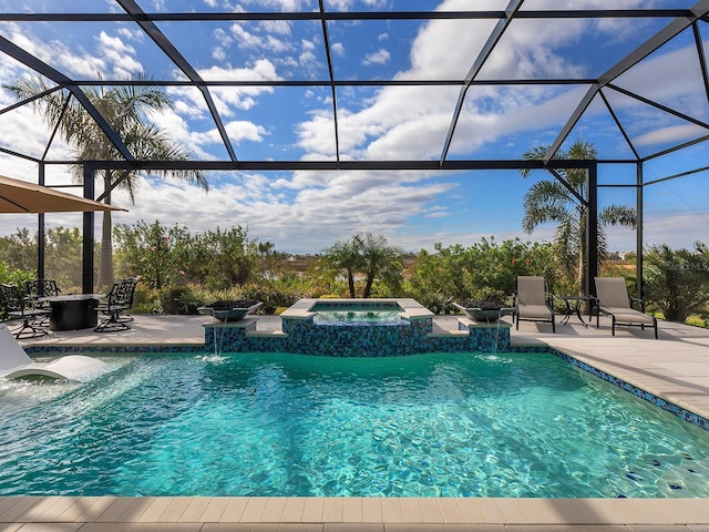 view of swimming pool with an in ground hot tub, a lanai, and a patio