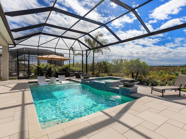 view of pool featuring a lanai, pool water feature, a patio area, and an in ground hot tub