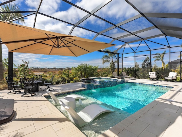 view of pool with pool water feature, a patio area, glass enclosure, and an in ground hot tub