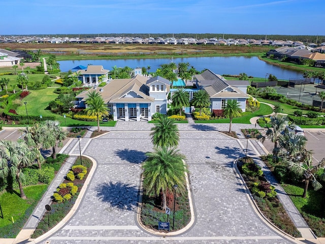 birds eye view of property with a water view