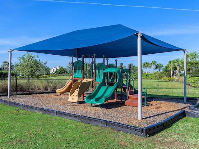 view of jungle gym with a lawn