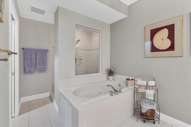 bathroom with independent shower and bath and tile patterned floors