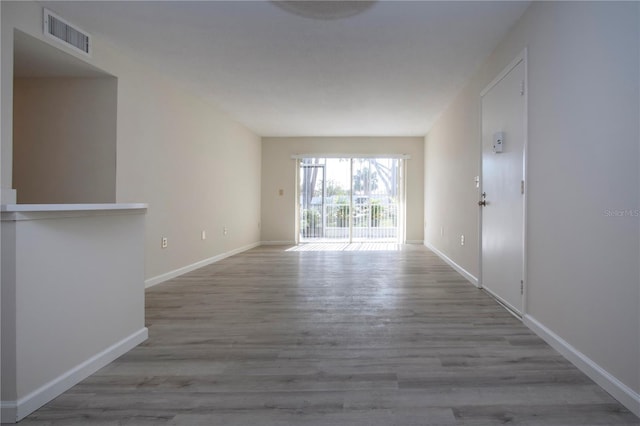 unfurnished living room with light hardwood / wood-style flooring