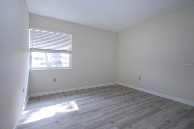 spare room featuring light hardwood / wood-style floors