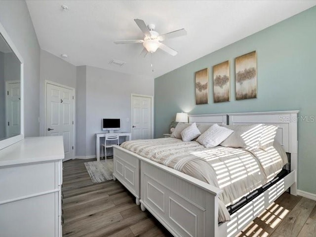 bedroom featuring hardwood / wood-style flooring and ceiling fan