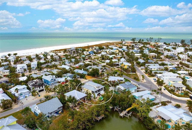 aerial view featuring a water view and a beach view