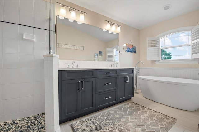 bathroom featuring lofted ceiling, separate shower and tub, and vanity