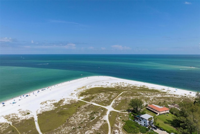 drone / aerial view featuring a water view and a beach view