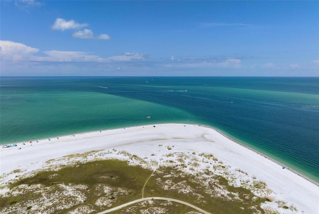 bird's eye view featuring a view of the beach and a water view