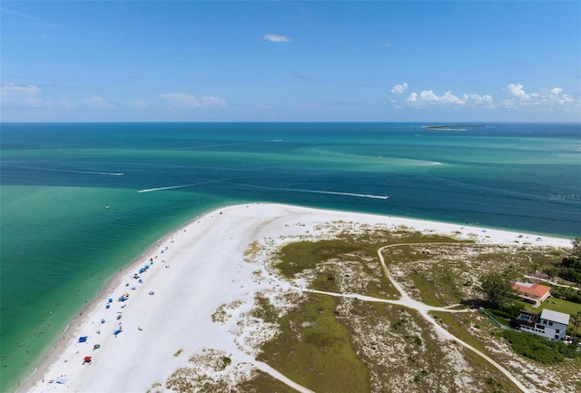 birds eye view of property with a view of the beach and a water view