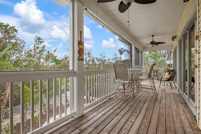 wooden terrace featuring ceiling fan