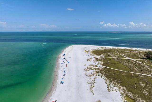 birds eye view of property featuring a view of the beach and a water view