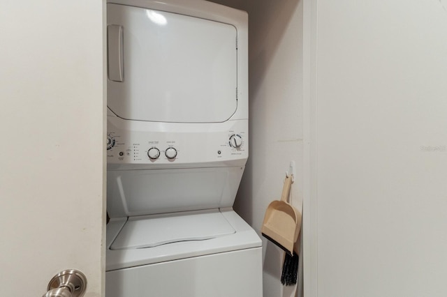 laundry area with stacked washer / drying machine