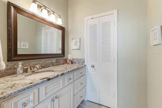 bathroom featuring tile patterned floors and vanity