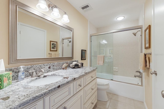 full bathroom with toilet, combined bath / shower with glass door, tile patterned floors, and vanity