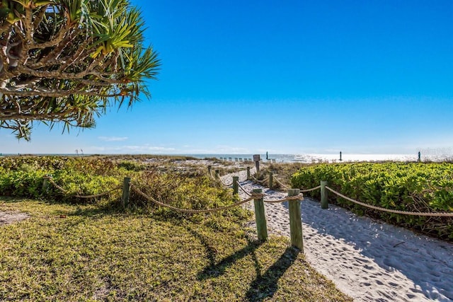 surrounding community featuring a water view