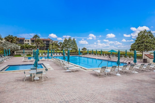 view of swimming pool featuring a patio