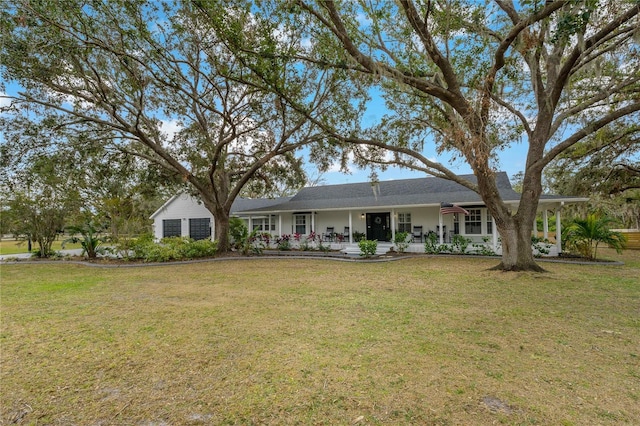 view of front facade with a porch and a front lawn