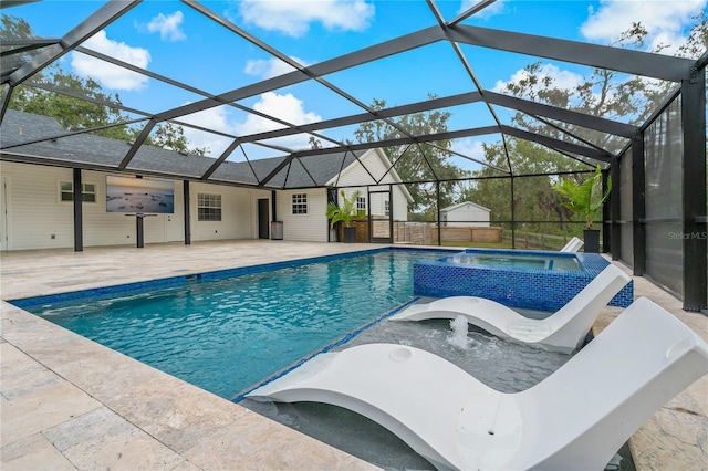 view of swimming pool with a lanai, an in ground hot tub, and a patio area