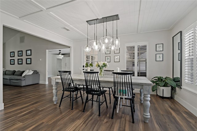 dining space with ceiling fan and dark hardwood / wood-style floors