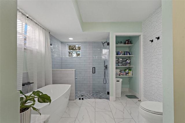 bathroom with toilet and shower with separate bathtub