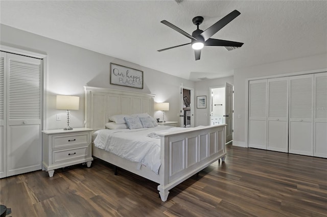 bedroom with a textured ceiling, ceiling fan, and dark hardwood / wood-style flooring