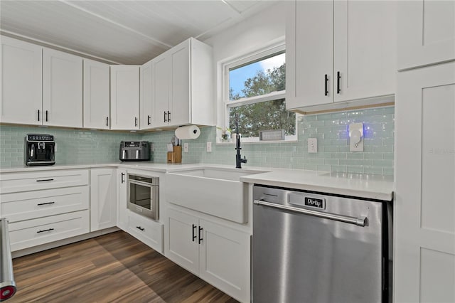 kitchen with dark wood-type flooring, dishwasher, decorative backsplash, white cabinets, and sink