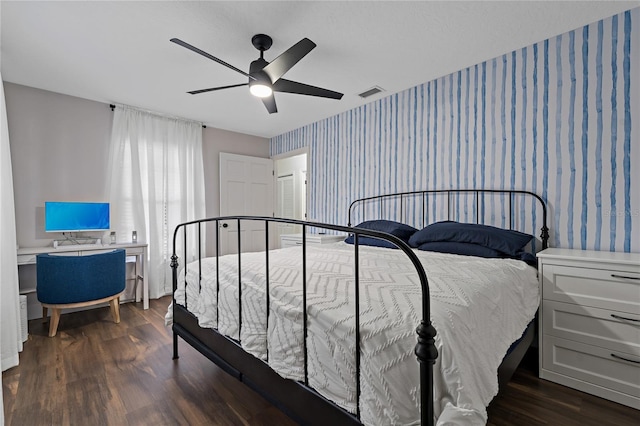 bedroom with dark wood-type flooring and ceiling fan