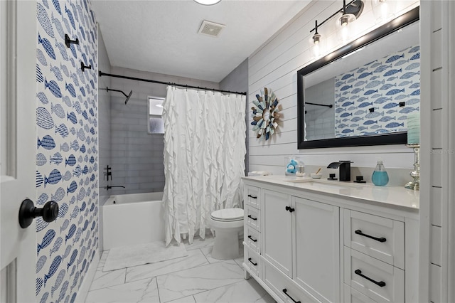 full bathroom featuring toilet, a textured ceiling, wood walls, shower / tub combo with curtain, and vanity